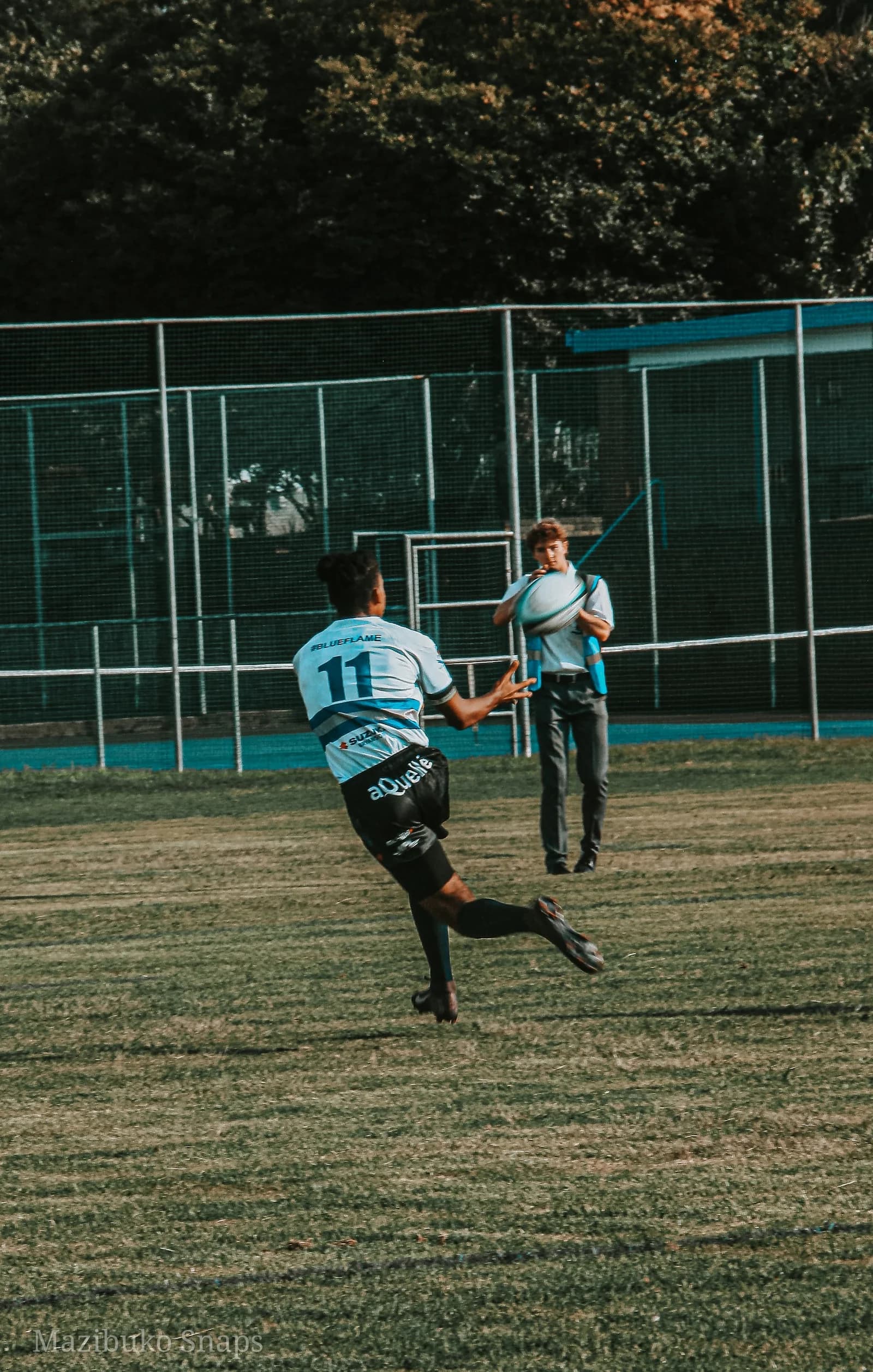 Faith running during a rugby match
