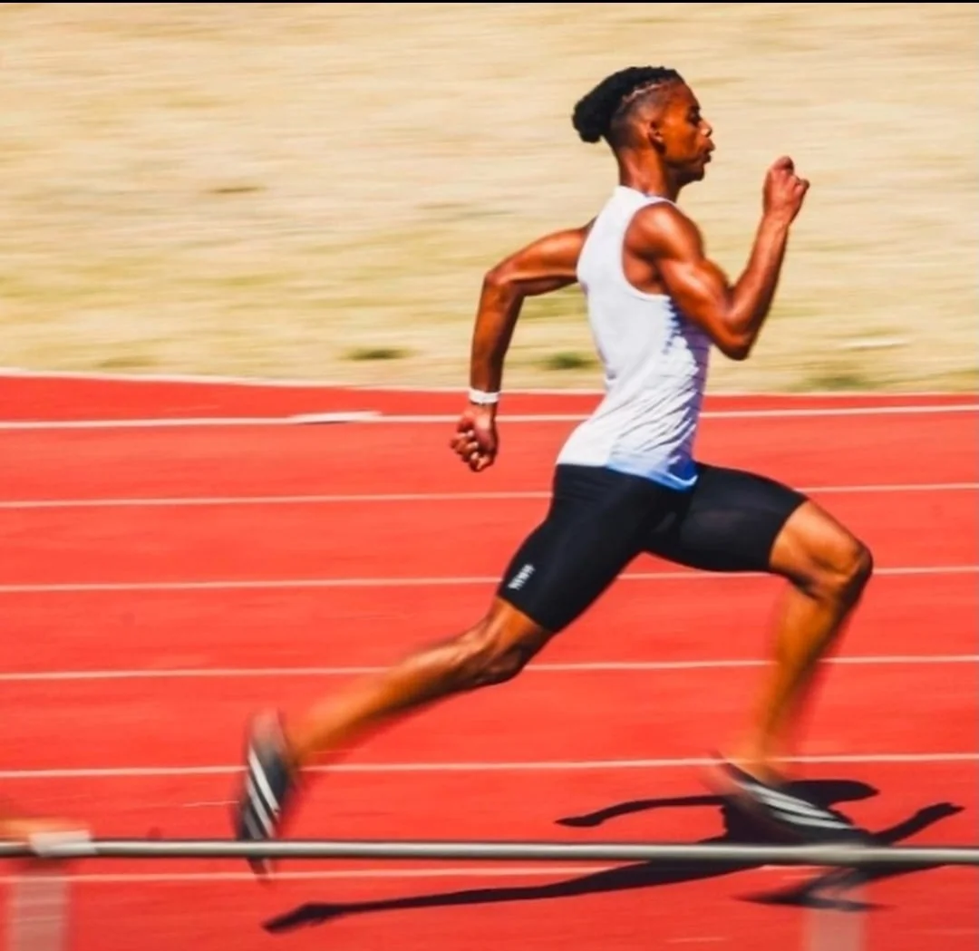 Faith sprinting on the athletics track
